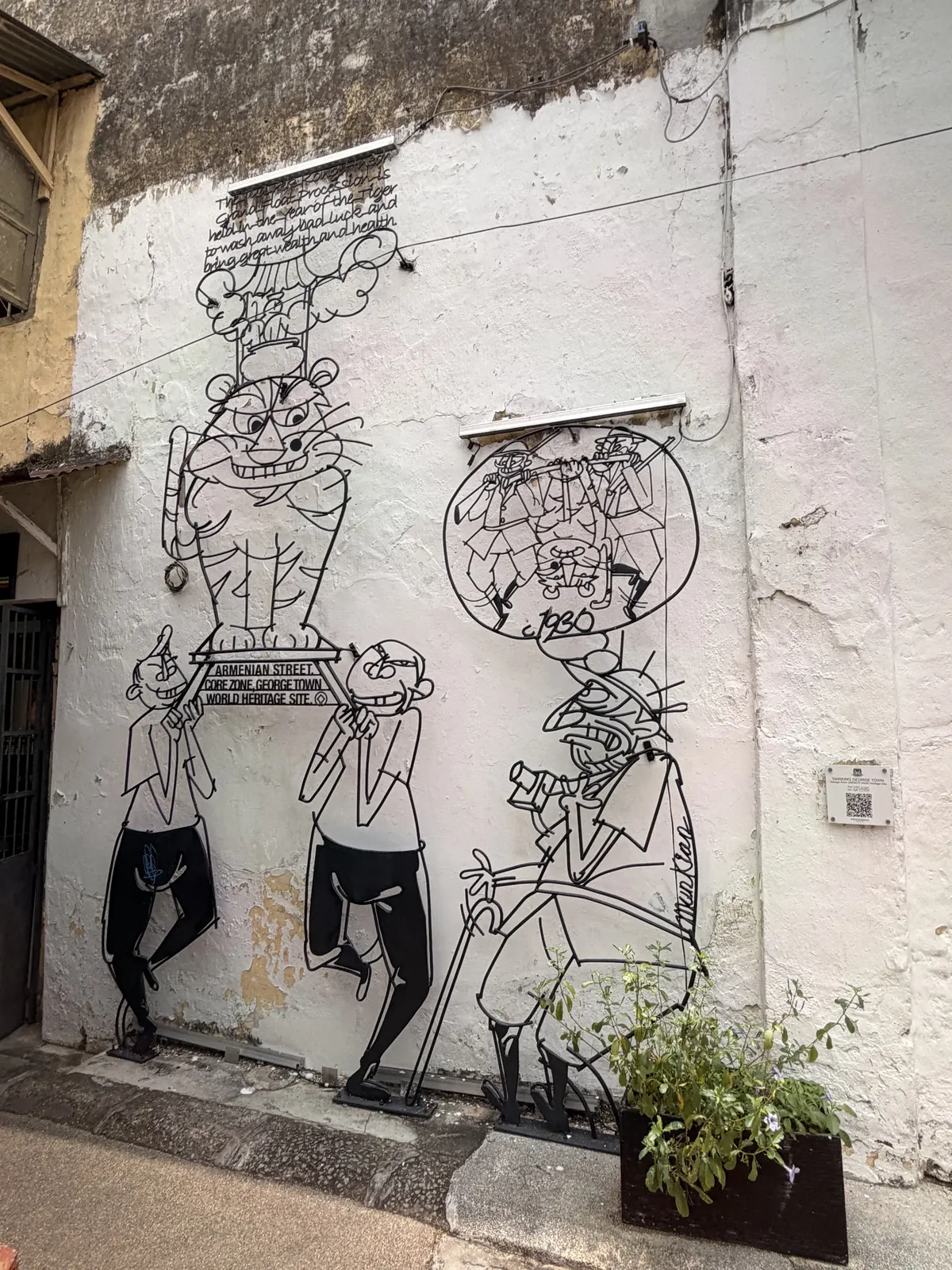 Streetart als Strichzeichnung an einer Hauswand in George Town